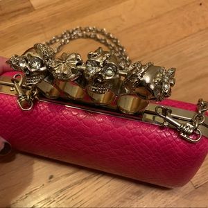 Brass knuckle skull rhinestone clutch
